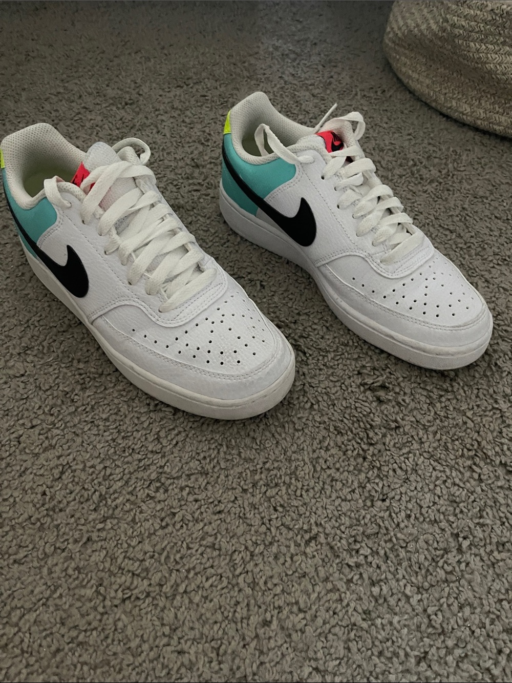Nike White Low-Top Sneakers with Black Swoosh and Teal Heel